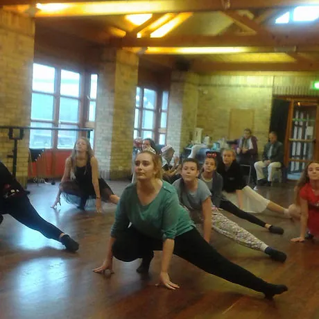 Pupils stretching at the start of a dance class in the Harlow studio